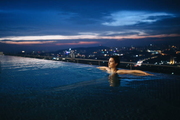 istock Night swimming in the pool in Malaysia 1067915202