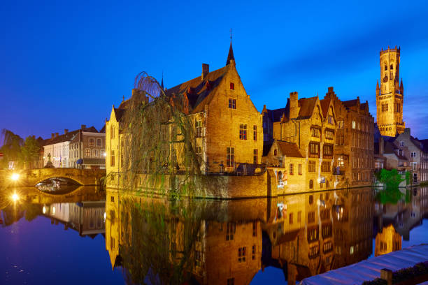 bruges belgium evening sunset with blue sky - belfort imagens e fotografias de stock