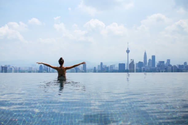 istock Swimming in the pool with a view 1067916328