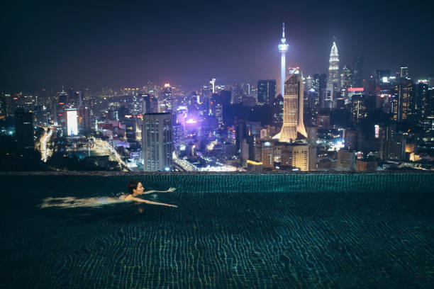 istock Night swimming in the pool in Malaysia 1067917828