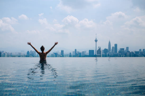 istock Swimming in the pool with a view 1067918420