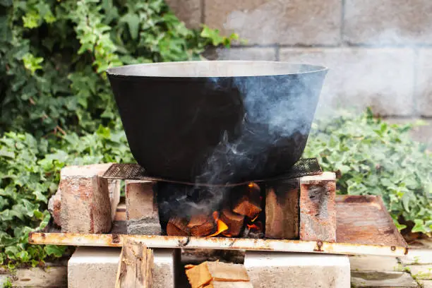 Photo of Cauldron on bonfire. Preparing of Chorba