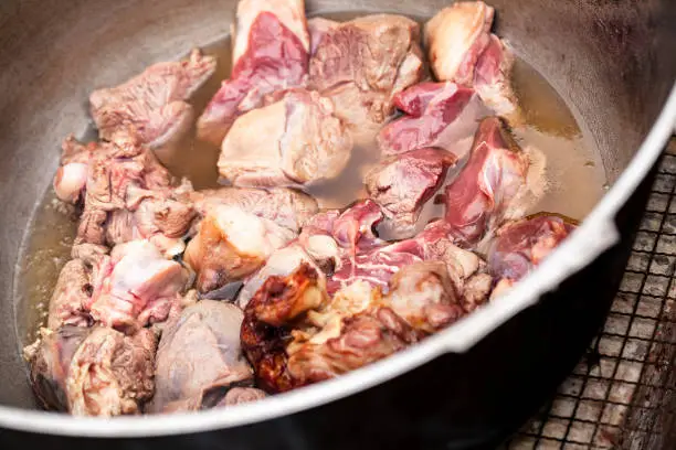 Photo of Lamb pieces stew in a cauldron