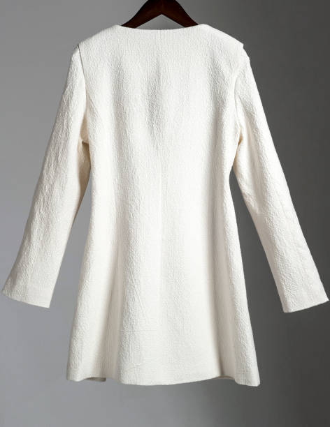 istock Ladies white coat hanging on a hanger 1067921326