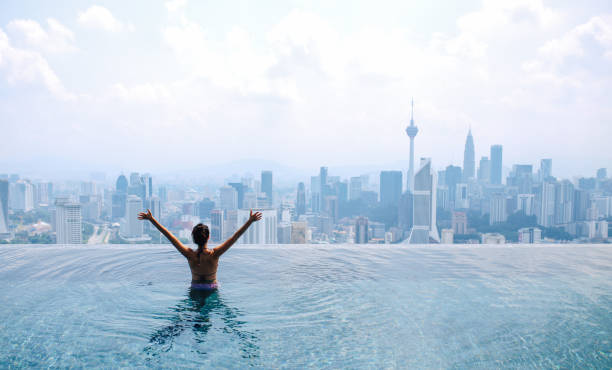 istock Swimming in the pool with a view 1067921578