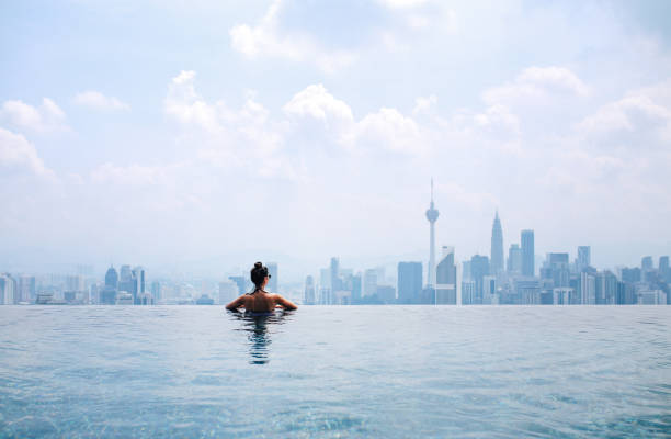 istock Swimming in the pool with a view 1067924278