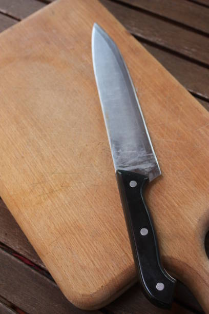 istock Kitchen knife on a wooden cutting board 1067924852