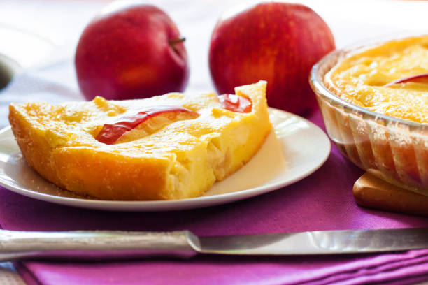 Almond pastry with apple slices isolated on white background.