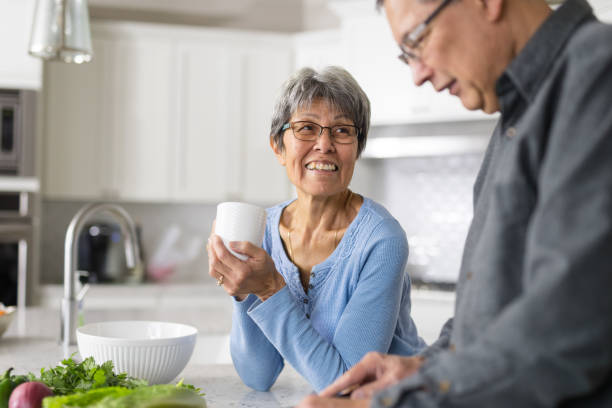 istock A senior couple makes lunch together 1067932340