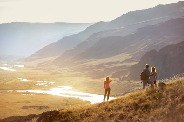istock Group tourists travel mountains view 1067934016