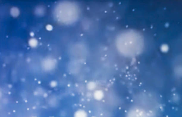 istock Abstract particle bokeh with dark blue background 1067934958