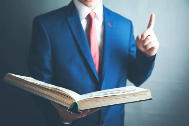 istock man hand book on gray background 1067938884