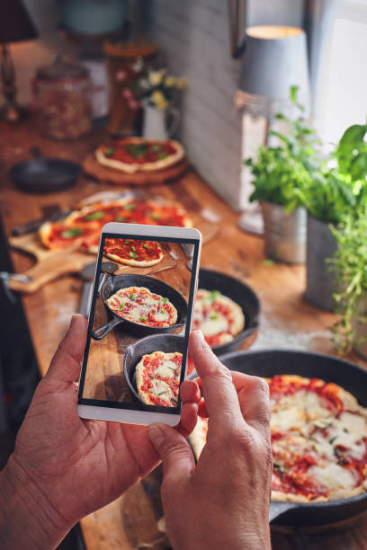 istock Preparing Pizza with Mozzarella and Ham in a Pan 1067939272