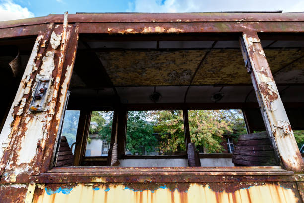 istock Old rusty wagon of destroyed tram outdoors 1067940486