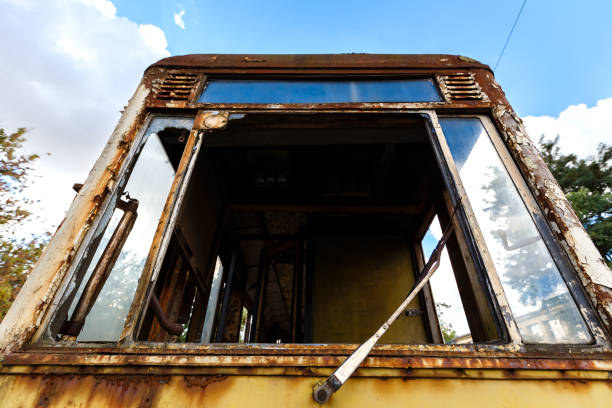 istock Cabin of old rusty destroyed tram outdoors at sunny day. 1067940500
