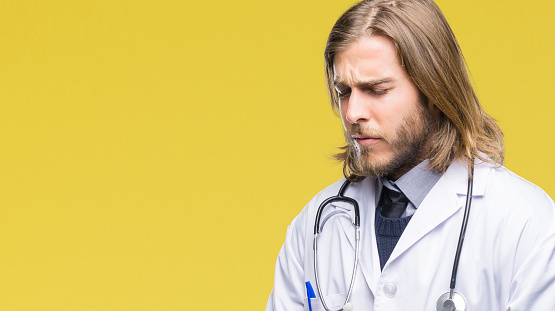 Young Handsome Doctor Man With Long Hair Over Isolated Background With Hand  On Stomach Because Nausea Painful Disease Feeling Unwell Ache Concept Stock  Photo - Download Image Now - iStock