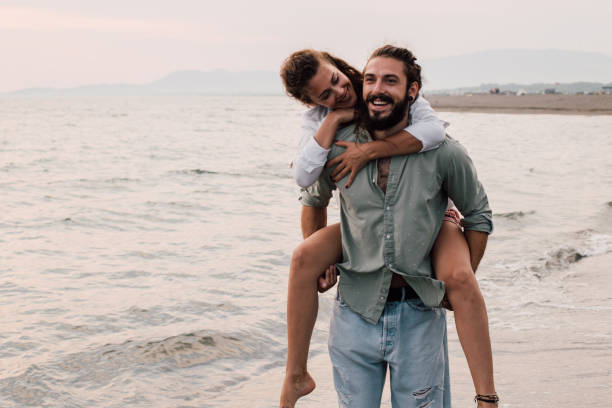 istock Couple in love at the beach 1067947784