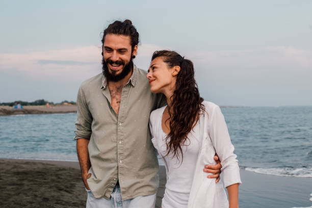 istock Couple in love at the beach 1067950656