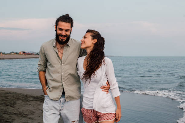 istock Couple hugging at the beach 1067950778