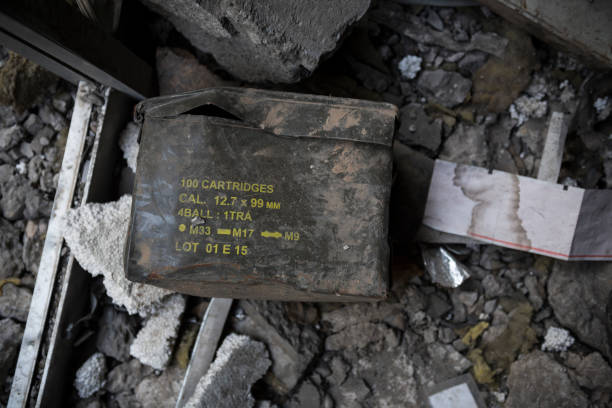 A discarded box of 100 .50 cal (12.7 x 99mm) cartridges lies on the floor of a destroyed building in Mosul, Iraq. Photo taken months after fighting between Iraqi government forces and ISIS. (May 2017)