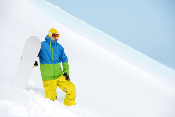 istock Snowboarder stands backcountry powder slope 1067952348