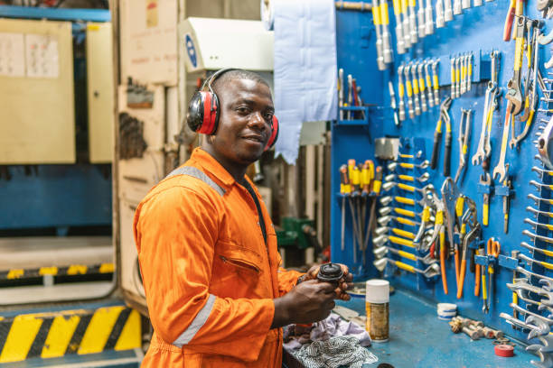 istock Marine engineer officer working in engine room 1067956994