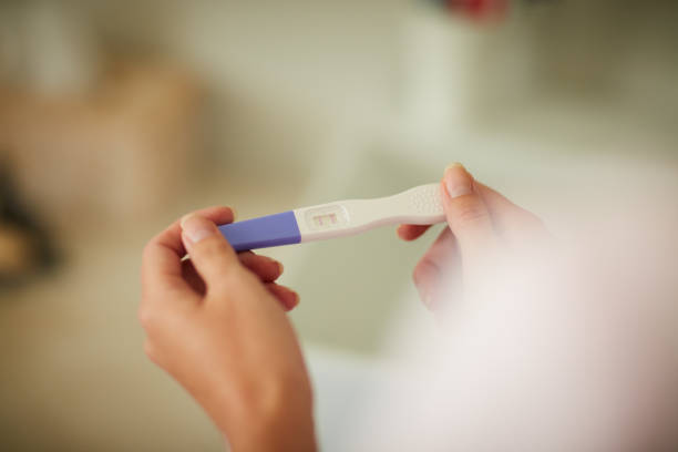 istock Checking the results of her pregnancy test 1067957172