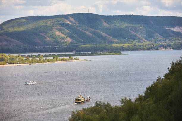 river against a cloudy sky with clouds and forest. - rowboat nautical vessel small motorboat imagens e fotografias de stock