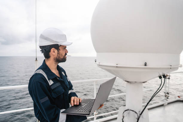 istock Service technician or serviceman near VSAT terminal 1067957468