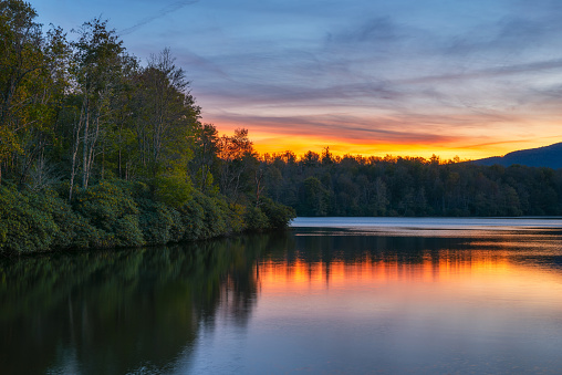 Beautiful sunset over Julian Price Lake reflections which is along the Blue Ridge Parkway near Blowing Rock, North Carolina