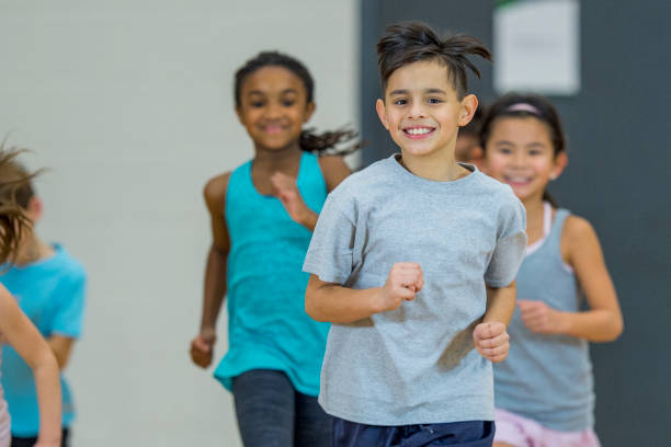 istock Children running in gym class 1067969184