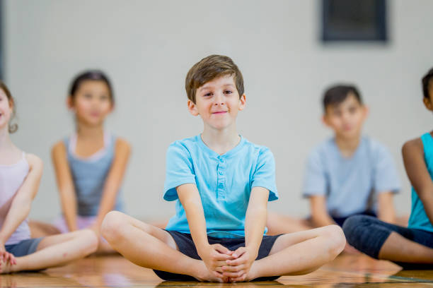istock Children sitting in gym class 1067969188