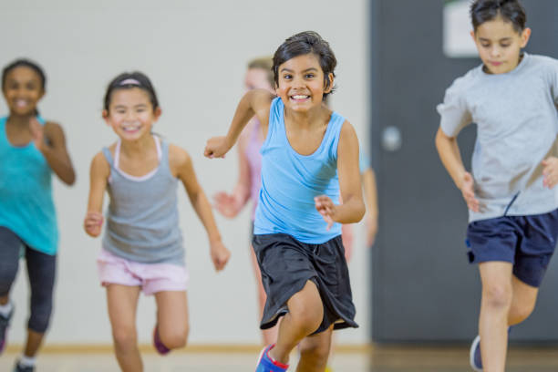 istock Children running in gym class 1067969222