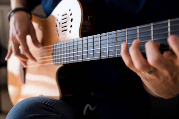 istock Musician playing classic guitar 1067974396