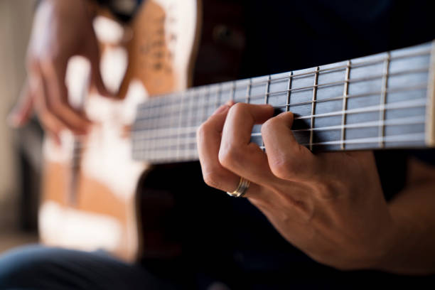 istock Musician playing classic guitar 1067974720