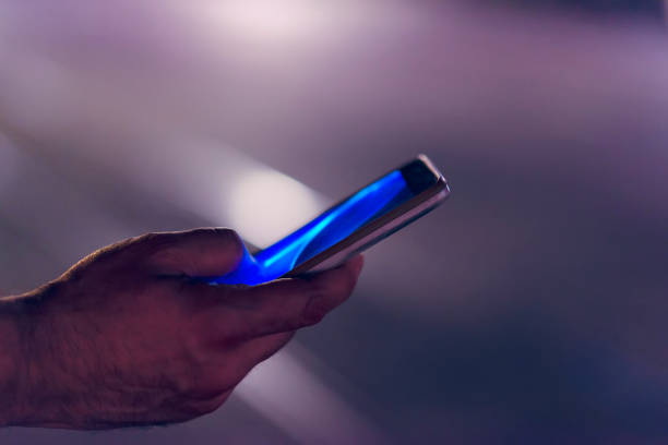istock Close View of Man with Smart Phone 1067975414