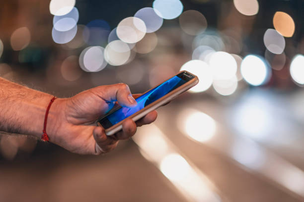 istock Close View of Man with Smart Phone 1067975428