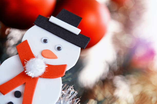 Christmas decoration. Decorative christmas ornaments hangin on an evergreen branch