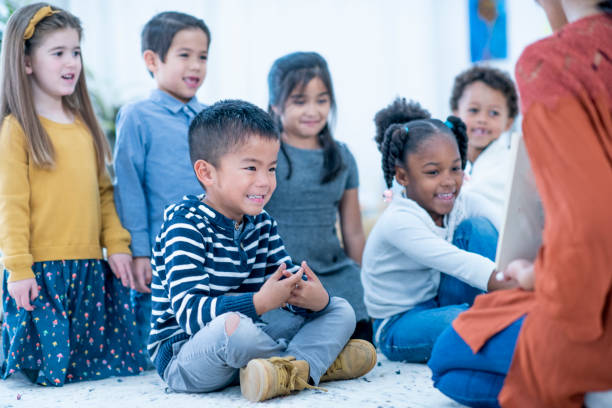 istock Kids laughing at story 1067979312