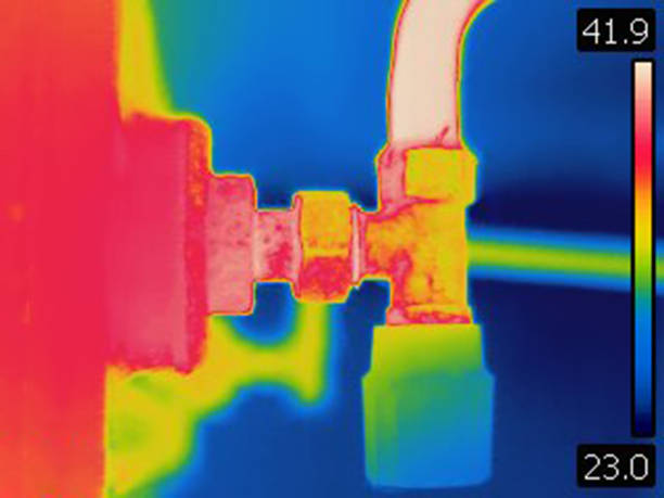 istock Thermal image of valve on home heating radiator. 1067990826