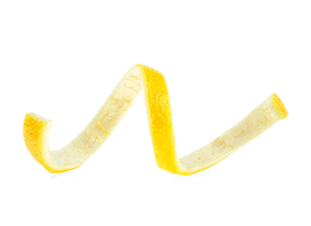 istock Lemon twist on white background. Healthy food. 1067991012