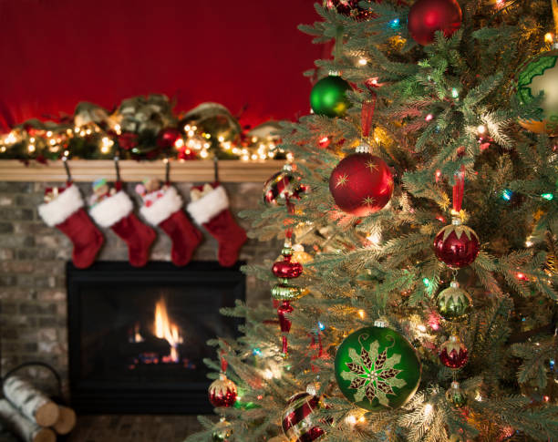 istock Christmas Tree and Fireplace with Stockings 1067997556