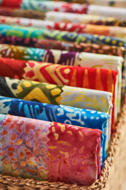 istock Folded bright pieces of quilting batik fabrics in a basket, macro 1068003660