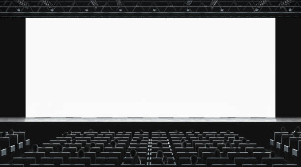istock Cinema hall with auditorium watching movie on blank screen mockup 1068006972