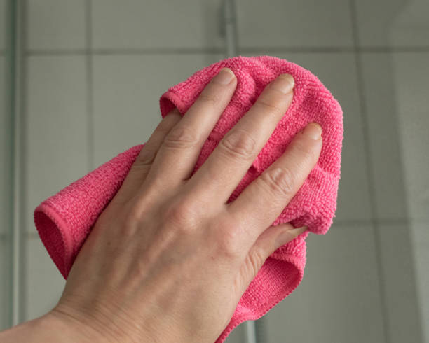 istock Hand cleaning a shower cabin 1068009642