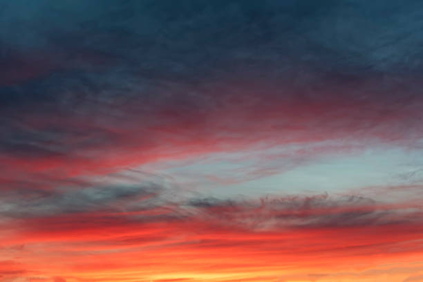 istock The sky with dark clouds illuminated by the setting sun 1068019550