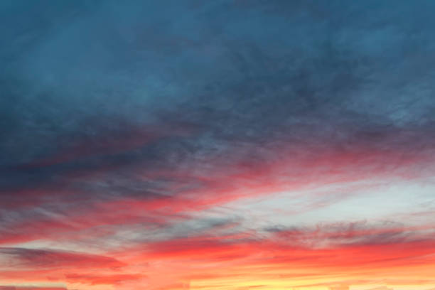 istock The sky with dark clouds illuminated by the setting sun 1068019562