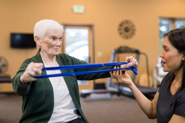 istock A senior woman works with her occupational therapist 1068023720