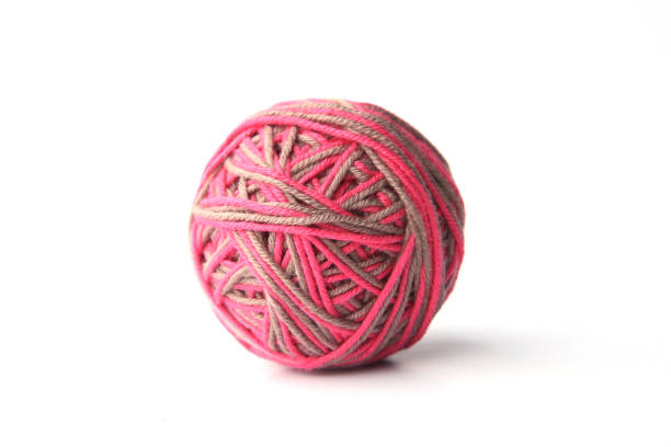 istock Colorful cotton thread ball from two color pink and grey thread  isolated on white background. 1068031282
