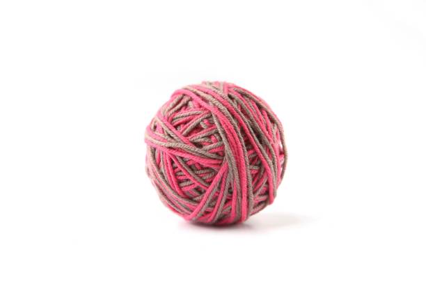 istock Colorful cotton thread ball from two color pink and grey thread  isolated on white background. 1068031300